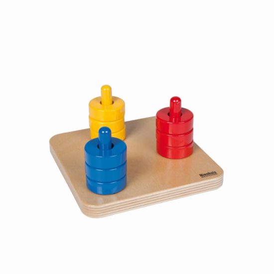 Coloured discs on coloured dowels / Montessori infant & toddler material - Nienhuis Montessori