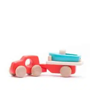 Handmade sustainable wooden toy vehicle Red truck with boat and trailer - Bajo