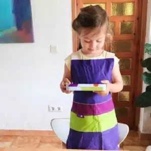 Crossback children's apron purple (100% cotton) - SKÅGFÄ