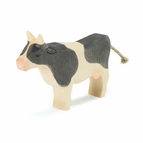 Standing black and white wooden toy cow Ostheimer family farm figures