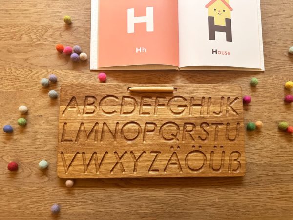 Wooden alphabet tracing board german Threewood Montessori inspired learning toy