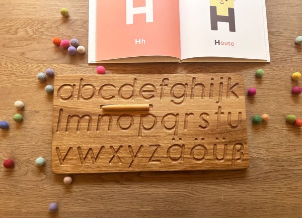Wooden alphabet tracing board german Threewood Montessori inspired learning toy
